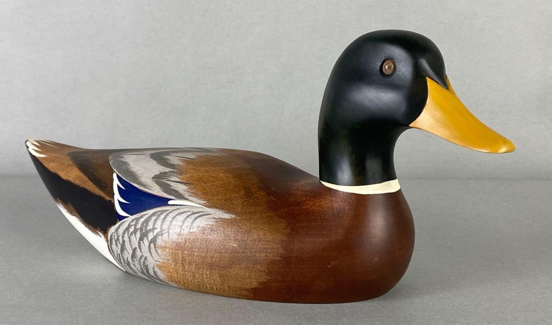 Ethan Allen P. Korman Mallard Wood Duck Decoy: Artists signature on base, Cracks in eyes, Measures 6 1/2 x 15 x 5 inches.