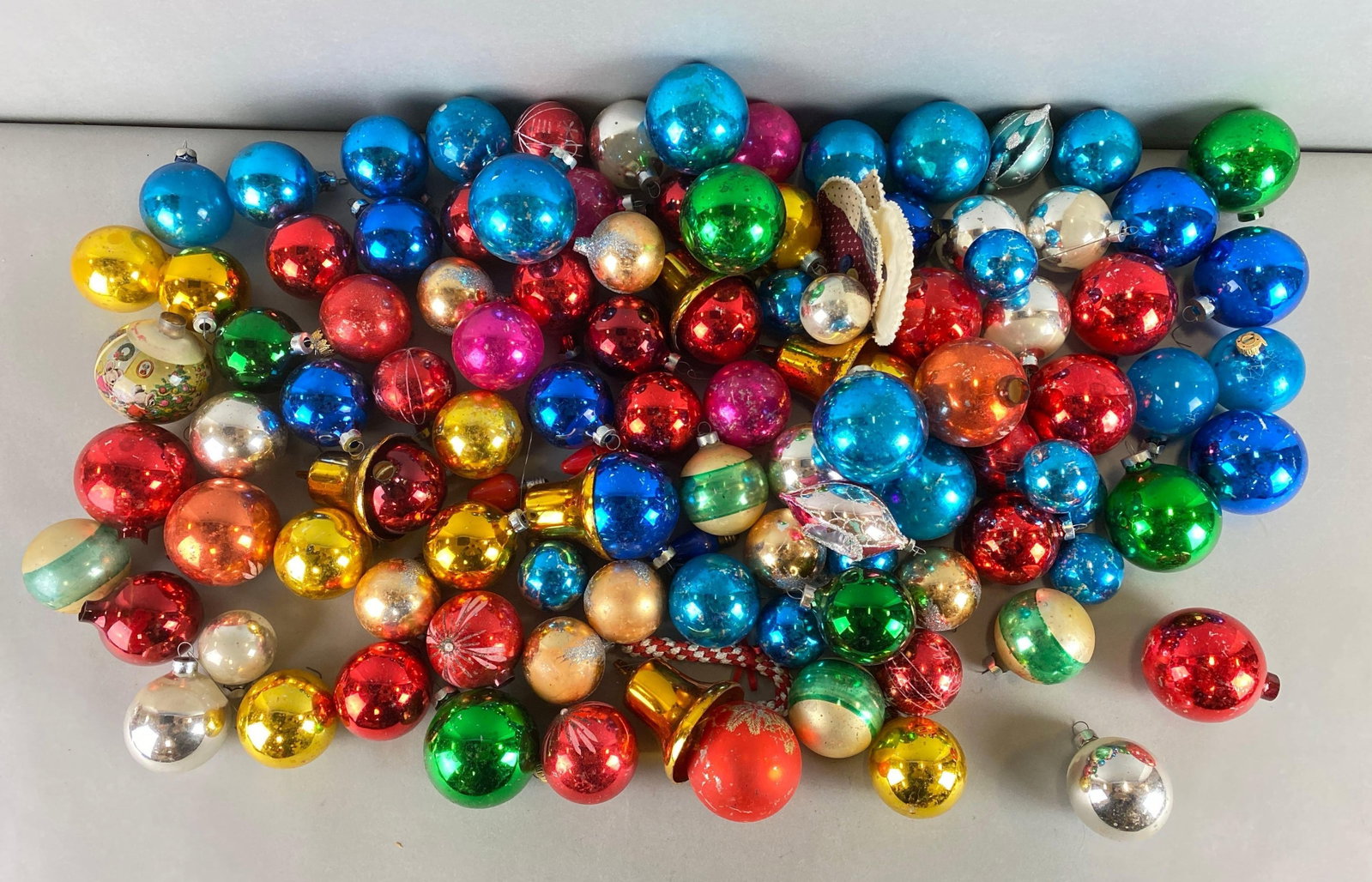 Large Group of Glass Christmas Ornaments: Includes blue, gold, silver and more. Largest ornament measures 3 x 2 1/2 x 2 1/2 inches.