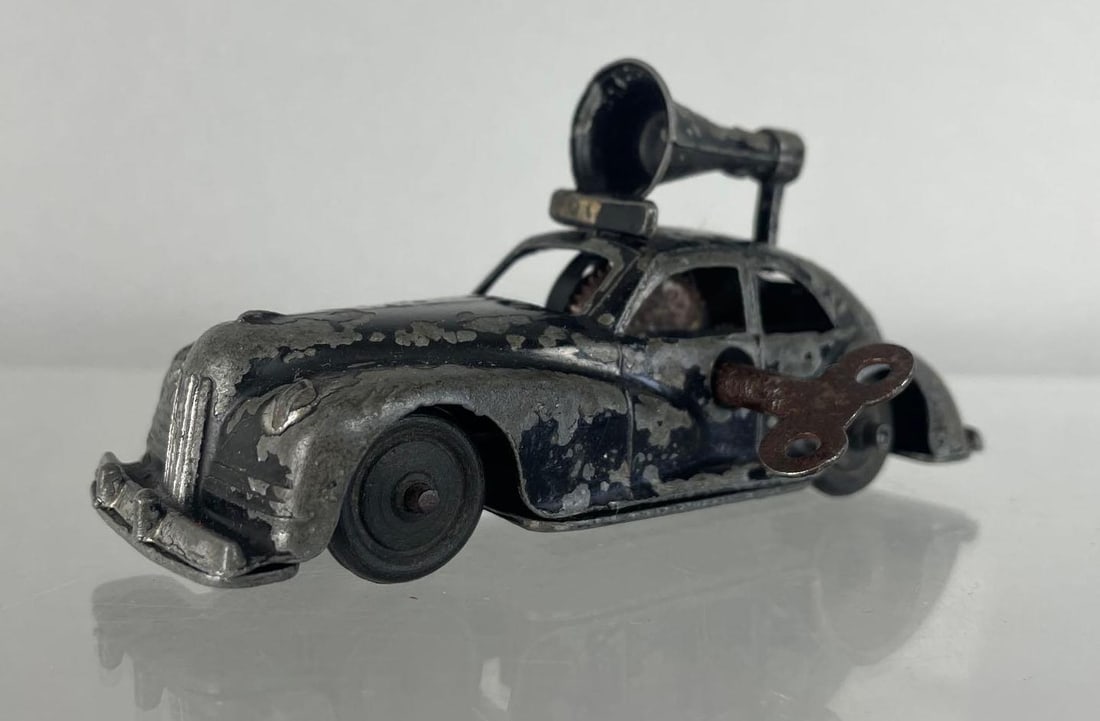 Vintage Kembo Wind-Up Tin Litho Police Car: Working condition, including key. Measures 4 3/8 inches long
