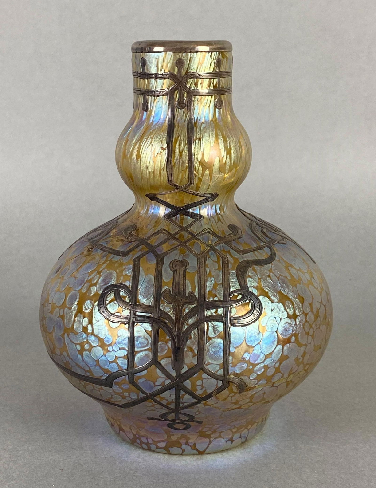 Antique Austrian Loetz Iridescent Oil Spot Art Glass Vase With Ornate Silver Inlay: Crack on rim, measures 6 x 4 1/2 x 4 1/2 inches