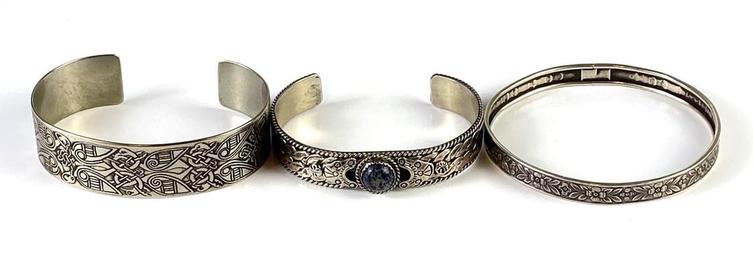 Group of 3 Sterling Silver Bangle and Cuff Bracelets: Total weight 70.7g, Largest measures 8 inches around inside.