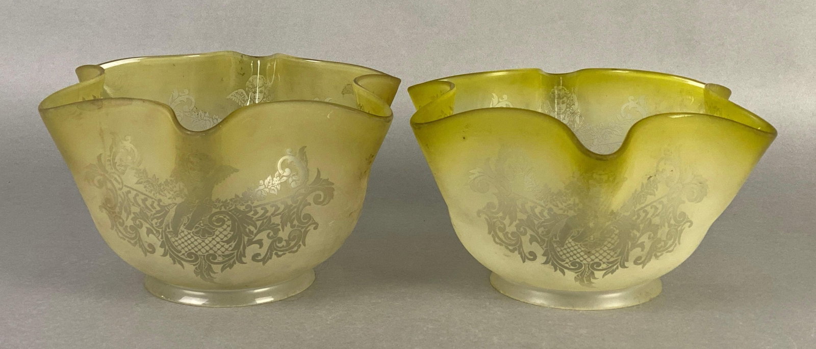 Group of 2 Antique Yellow Frosted Etched Angel Glass Lamp Shades: Ruffled edges, largest measures 4 3/4 x 7 1/2 inches, fitters measure 3 3/4 inches