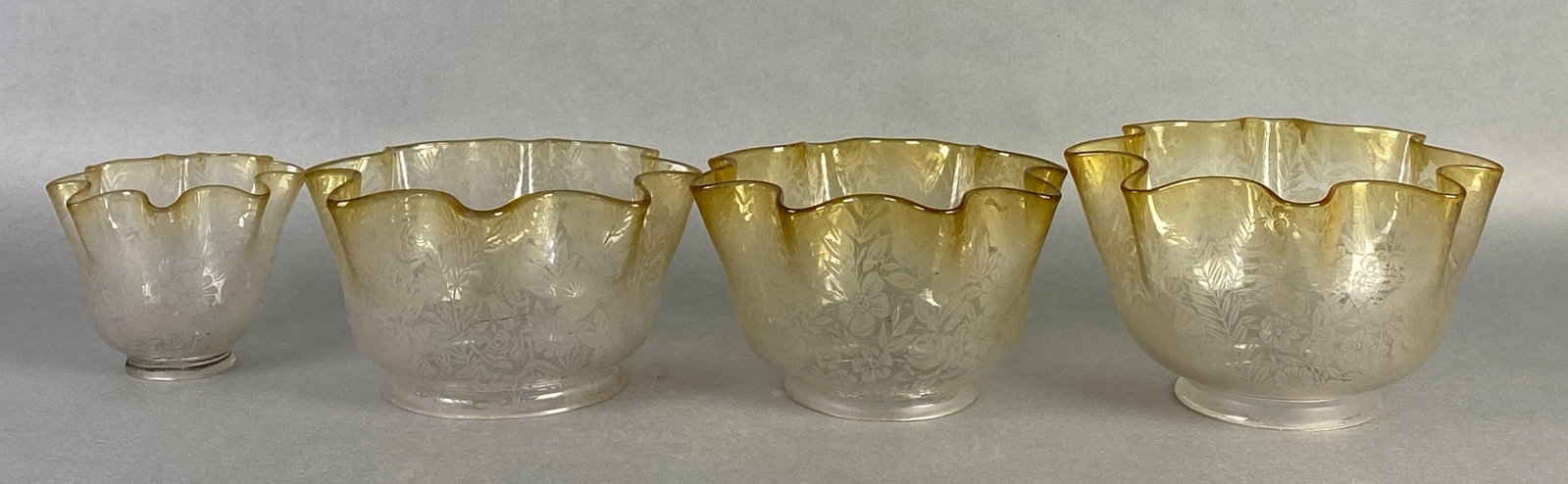 Group of 4 Antique Clear Etched Glass Lamp Shadea: Amber ruffled edges, largest measures 5 x 8 inches, fitter measures 4 inches