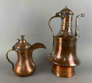 Group of 2 Ornate Middle Eastern Copper Finished Pitchers