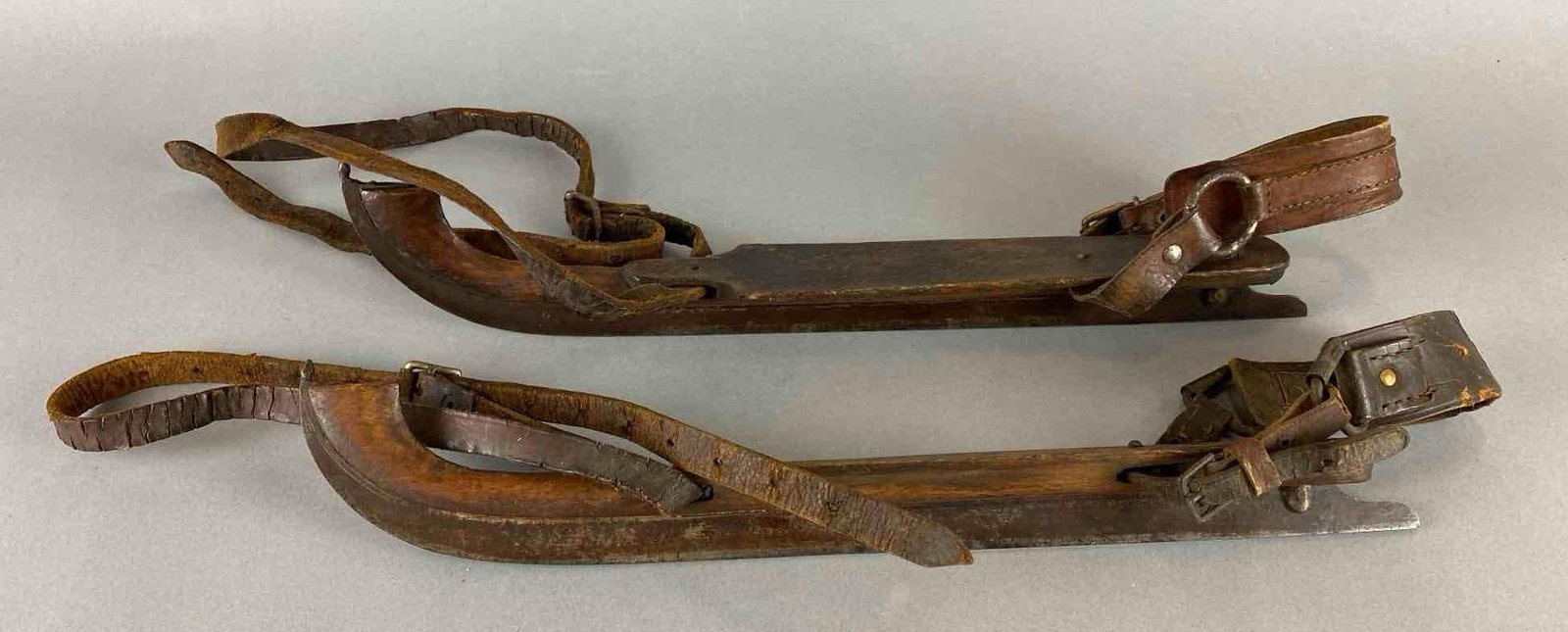 Antique German Wood Ice Skates: Wear with age. Largest measures 14 x 2 x 2 inches.