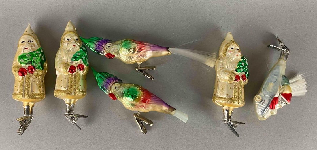 Group of 6 German Blown Glass Christmas Clip Ornaments: Includes Santa on a plane, Santa and Birds. Santa plane is missing wing. Largest measures 6 1/2 x 1 1/2 x 1 1/4 inches.