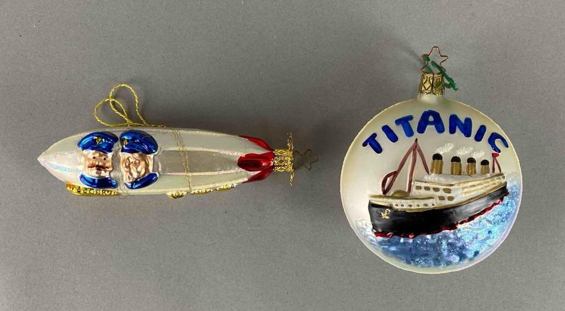 Group of 2 German Blown Glass Christmas Ornaments: Includes Titanic and a Zeppelin. Largest measures 4 x 3 1/2 x 2 inches.