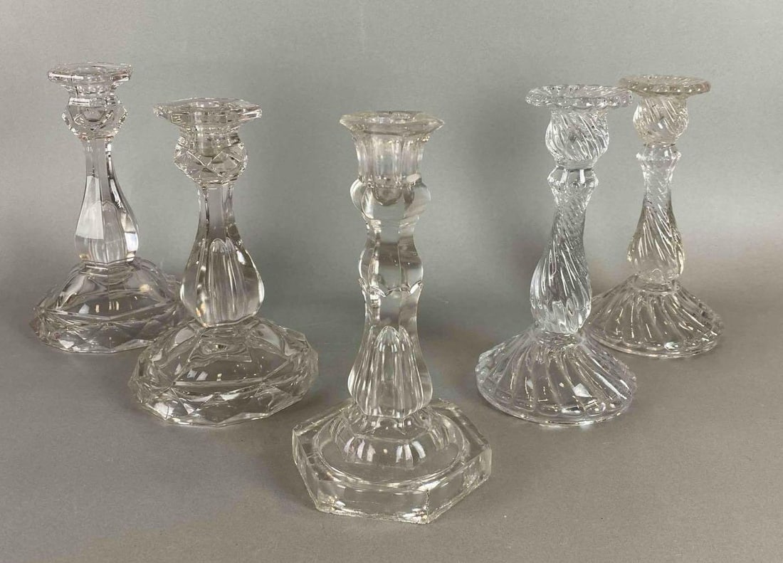 Group of 5 Crystal CandleSticks: 3 different patterns. One is chipped. Largest measures 7 3/4 x 4 1/2 x 4 1/2 inches.