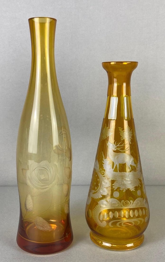 Group of 2 Bohemian Orange Etched Glass Vases: Includes floral, and Deer scene, Tallest measures 13 3/4 x 3 3/4 x 3 3/4 inches.