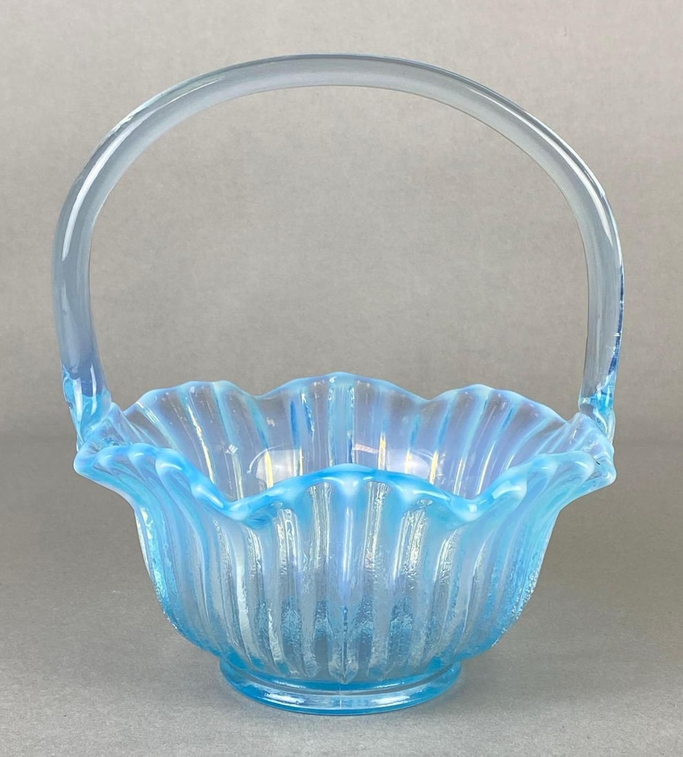 Iridescent Blue Glass Scalloped Ribbed Basket: Possibly L.E. Smith, Measures 7 1/2 x 7 x 6 3/4 inches.