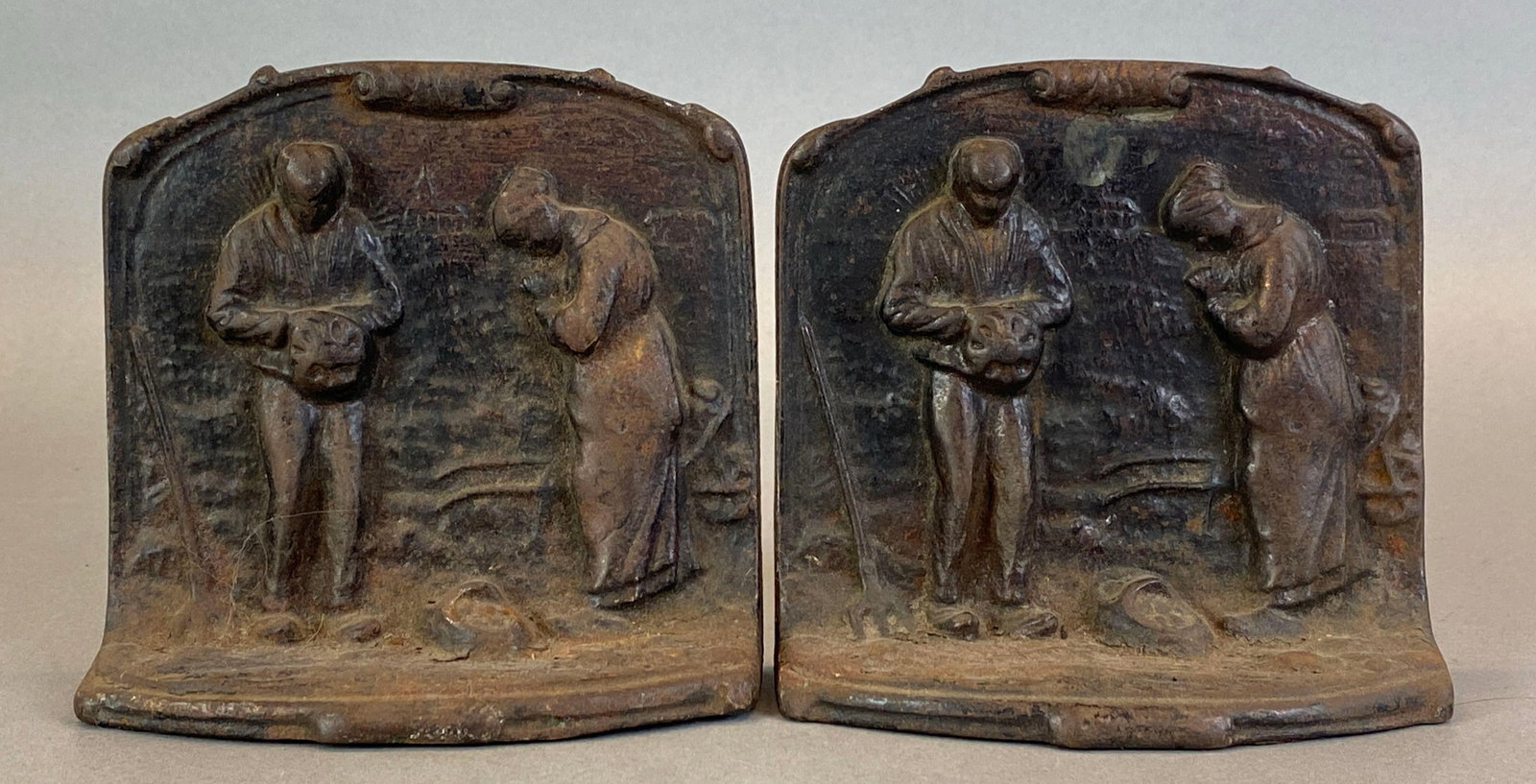 Pair of Cast Iron Praying Farmers Bookends: Each measures
