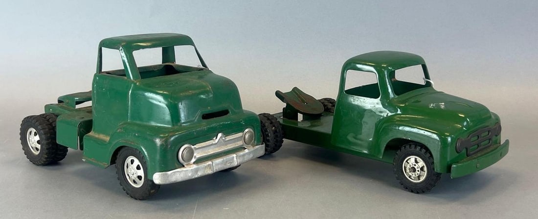 Group of 2 Vintage Pressed Steel Trucks: Smaller buddy L, larger is dunwell, measures 6 1/4 x 10 3/4 x 5 3/4 inches