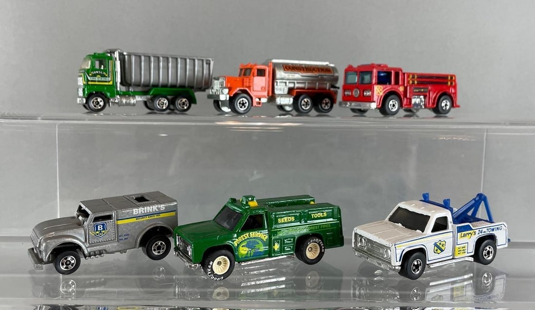 Group of 6 - 1970s / 80s Mattel Hot Wheels Trucks: Includes fire eater, funny money, sunset dump truck, and more