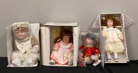 Group of 4 Assorted Porcelain Dolls