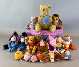 Group of Assorted Winnie The Pooh Plush Toys and More
