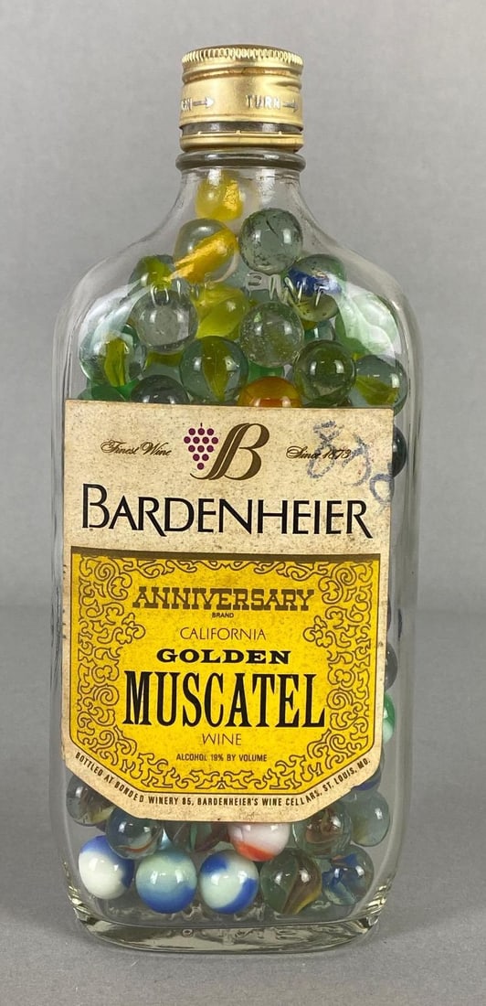 Group of Marbles in Bardenheier Muscatel Wine Bottle: Bottle measures 8 3/4 x 3 1/2 x 1 3/4 inches.