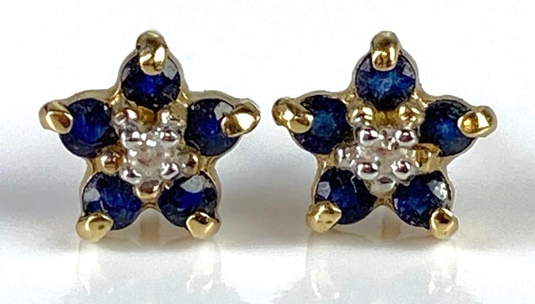 Pair of 10K Gold Sapphire and Diamond Earrings: Total weight 0.8g, Both measure 1/4 inch long.
