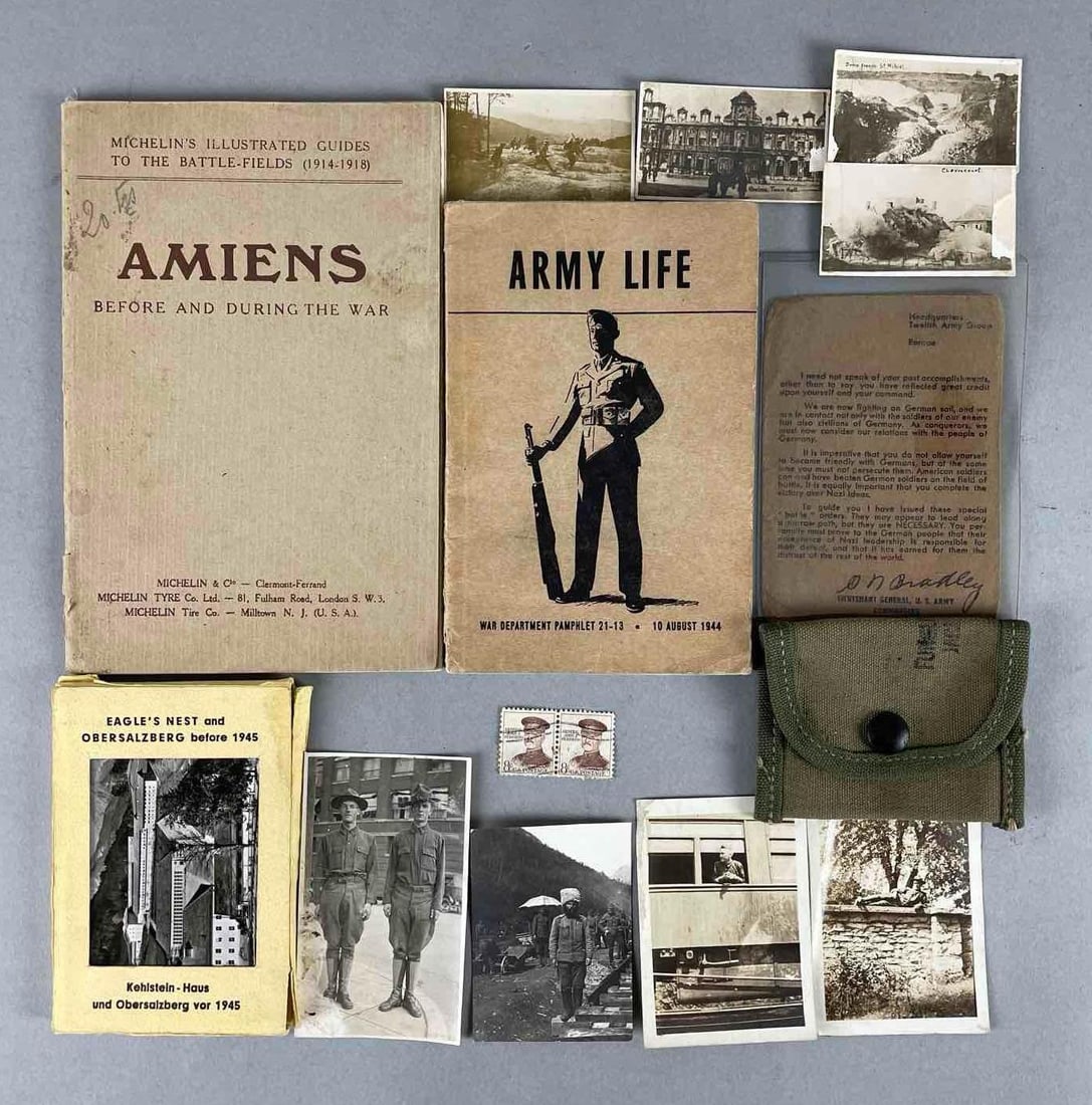 Group of 14 WW1 and WW2 U.S. Army Ephemera: Includes 1944 army life manual, 1919 Amiens before and during the war, photographs and more. Largest measures 8 x 5 1/2 inches