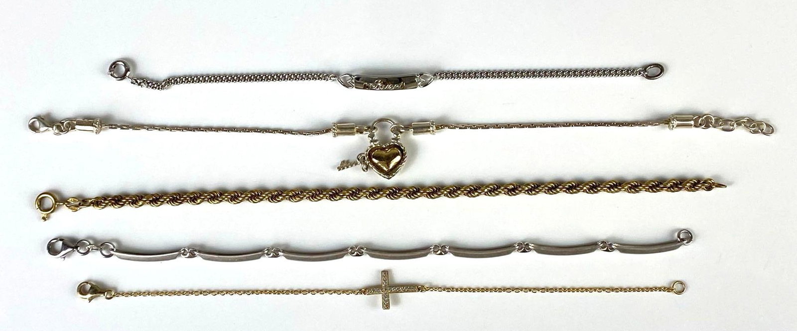 Group of 5 Sterling Silver Bracelets: Includes vermeil layered, Includes personalized Janet, heart and key, CZ cross, and more, Longest measures 9 inches long.