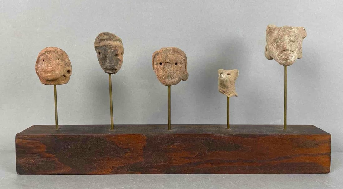 Display of Latin American Pottery Effigy Masks: Likely pre-Columbian. Measures 6 x 12 x 1 1/2 inches