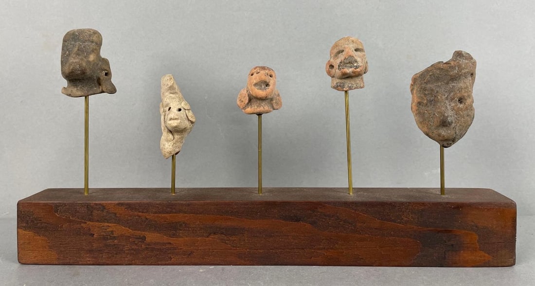Display of Latin American Pottery Effigy Masks: Likely pre-Columbian, measures 6 x 12 x 1 1/2 inches