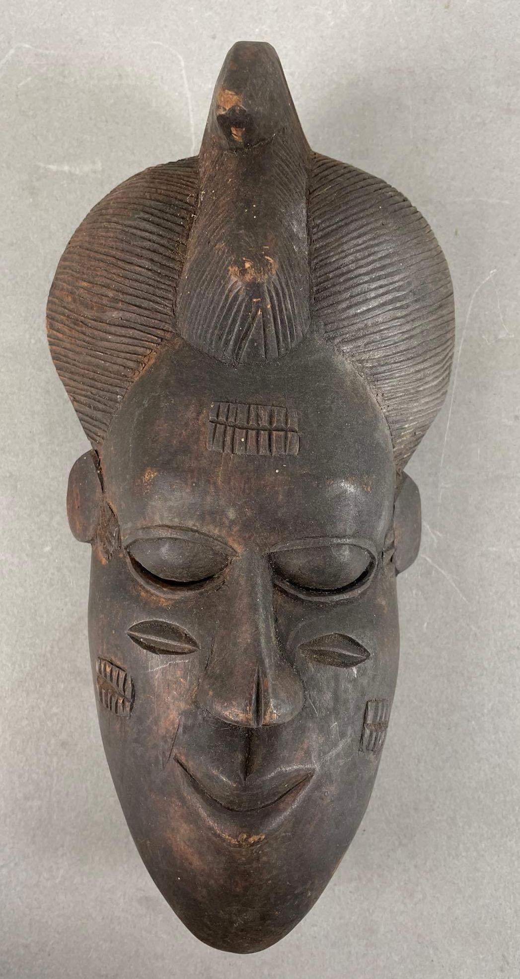 African Carved Wood Mask: Measures 10 x 5 x 3 1/4 inches