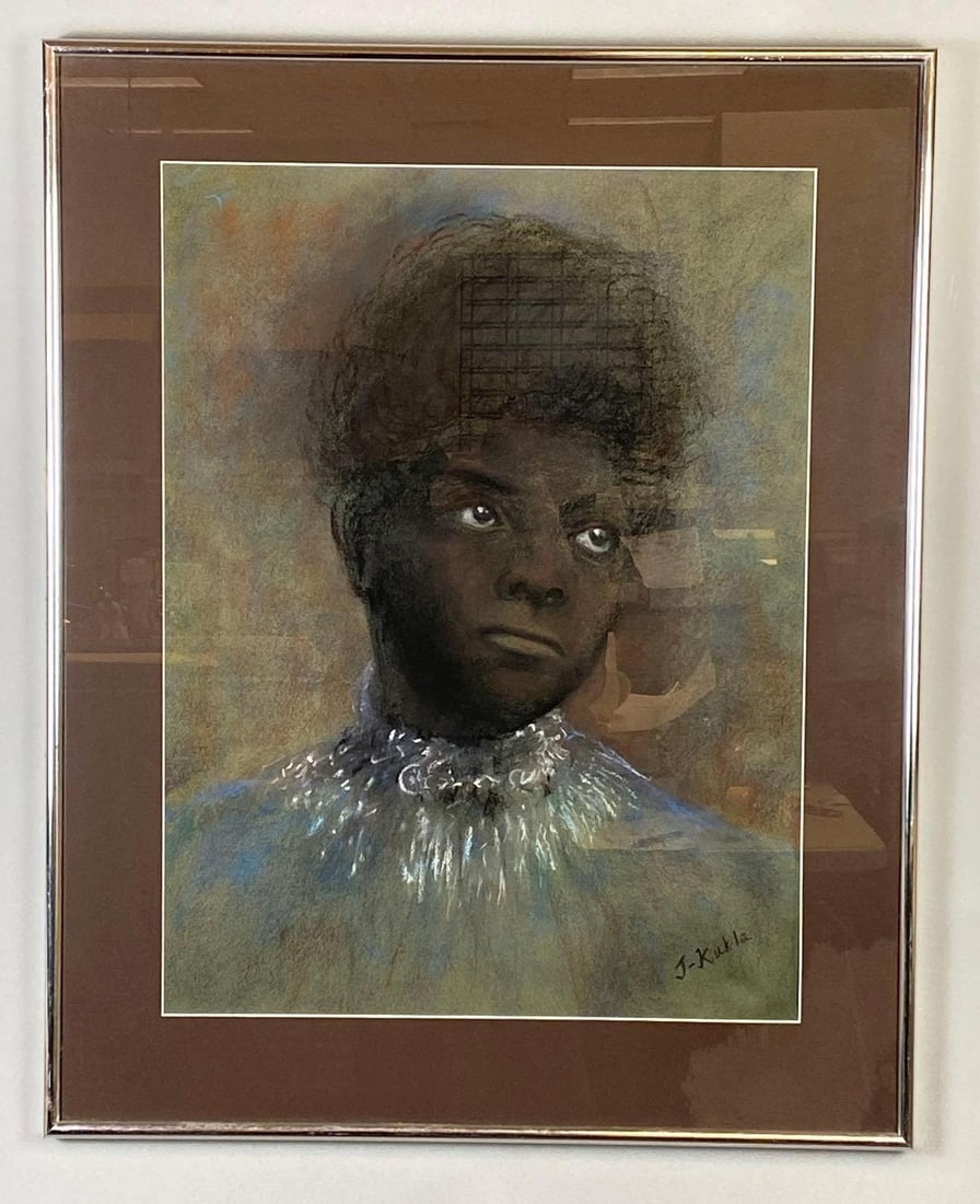 J-Kukla Ida B. Wells Portrait Oil Pastel Drawing on Paper: Artists signature on bottom right corner, Some moisture damage on bottom right corner of matting, Frame measures 30 1/4 x 24 1/4 inches, Drawing measures 24 x 18 inches.