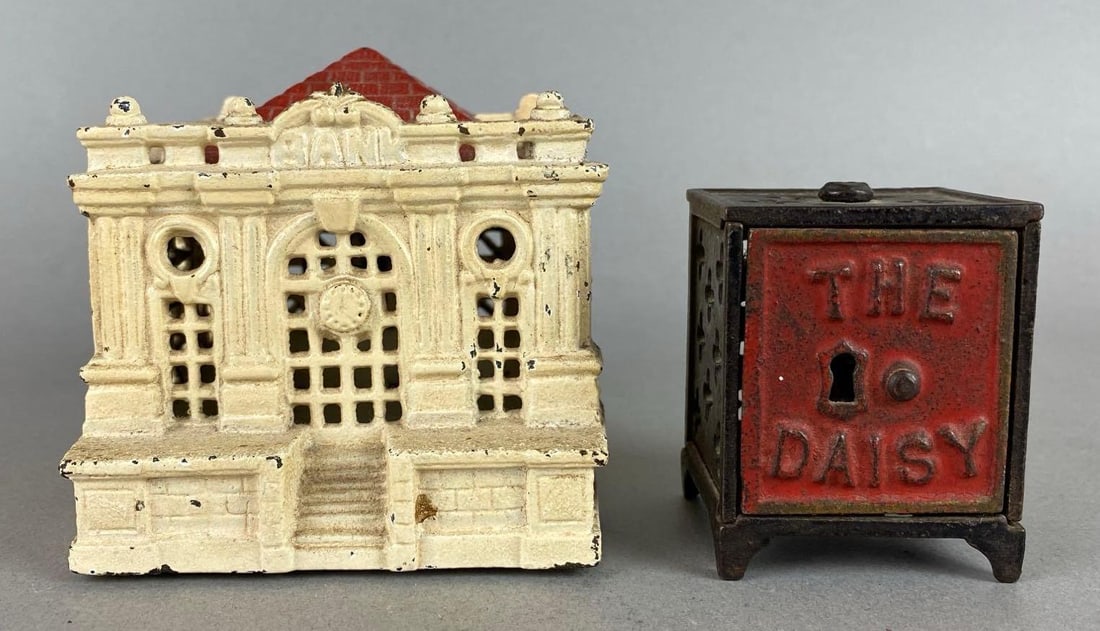 Group of 2 Cast-Iron Coin Banks: Includes Bank building and a safe. Largest measures 2 3/4 x 3 1/4 x 3 3/4 inches