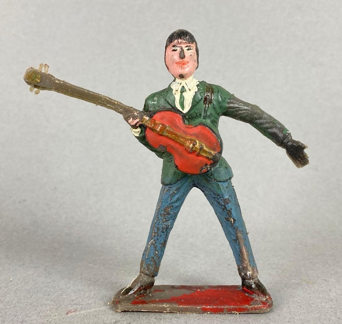 The Beatles Paul McCartney Plastic Figurine: Marked Hong Kong on bottom and back. Measures 3 x 3 1/4 x 5/8 inches.