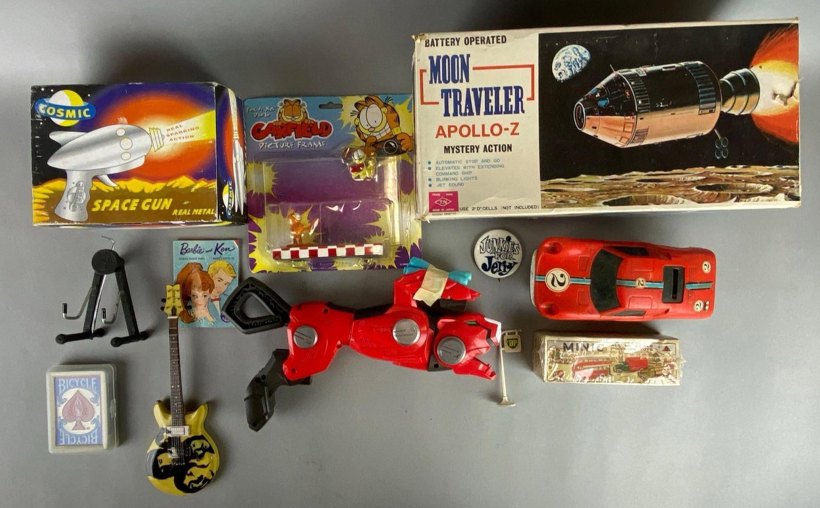 Group of Assorted Toys: Unknown working condition for items. Includes a deck of cards, nerf gun, Beatles guitar and more. Largest item measures 6 1/2 x 13 x 6 1/2 inches