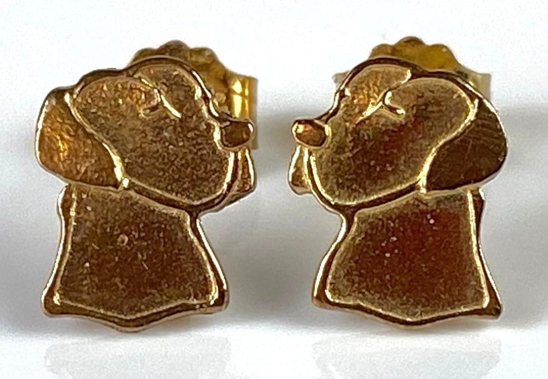 Pair of 14K Gold Dog Stud Earrings: Total weight 0.8g, Both measure 1/4 inch long.