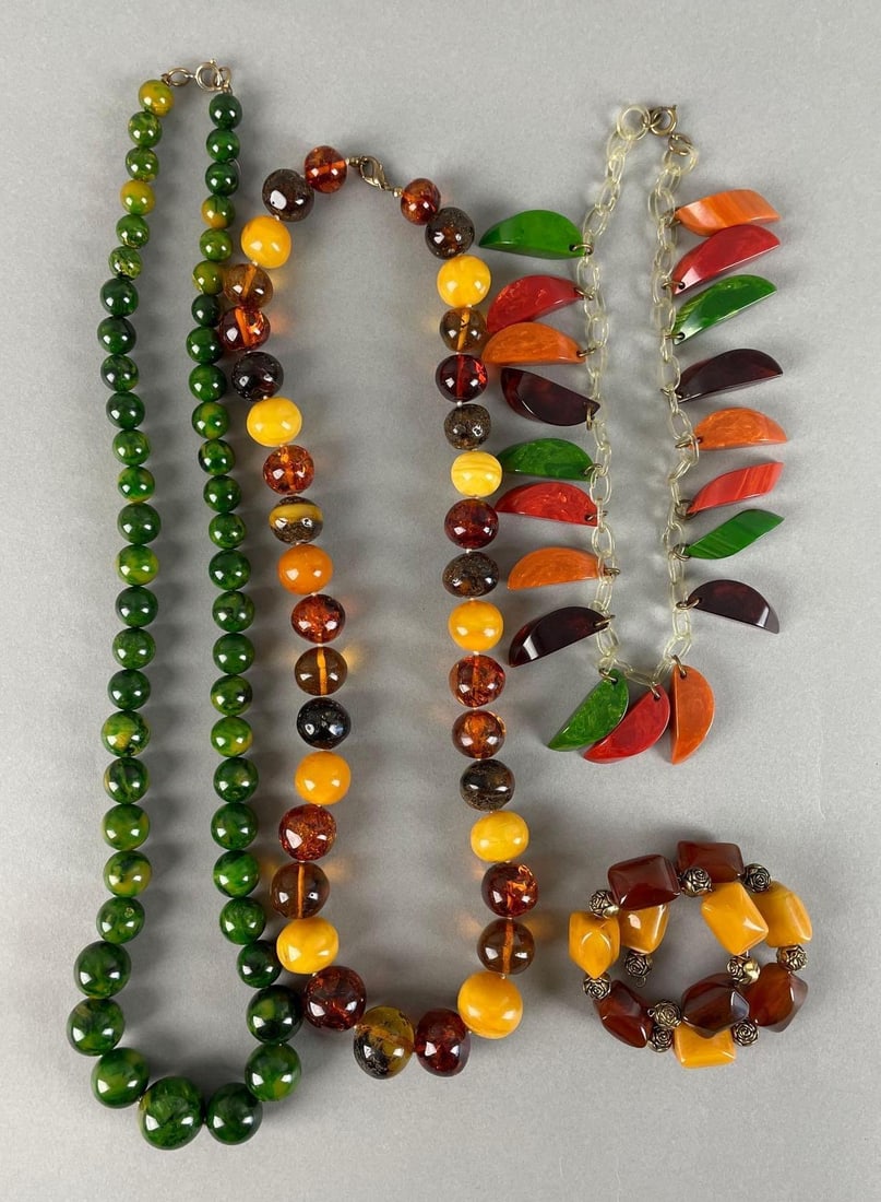 Group of Bakelite / Plastic Beaded Costume Jewelry: Includes coiled bracelet, green necklace measures 27 inches