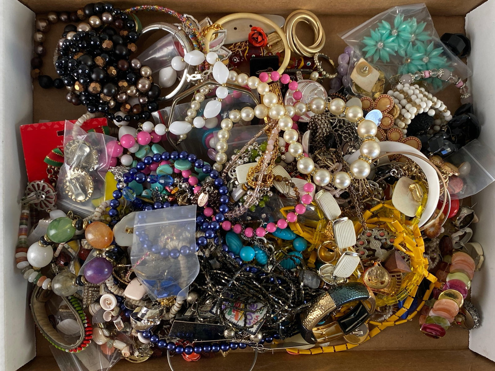 Group of Costume Jewelry: Includes necklaces, earrings, bracelets and more, many tangled together
