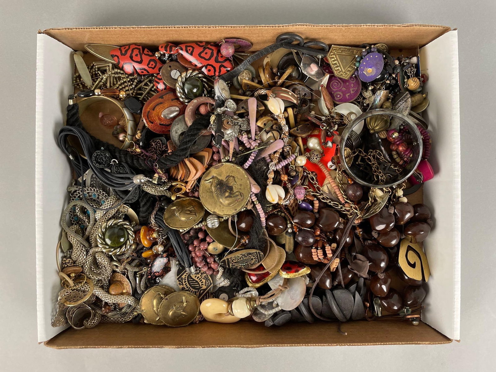Group of Costume Jewelry: Includes necklaces, bracelets, brooches and more, many tangled together
