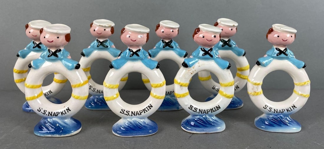 Set of 8 Enesco Porcelain S.S. Napkin Rings: Some small chips, each measure 3 1/2 x 2 inches