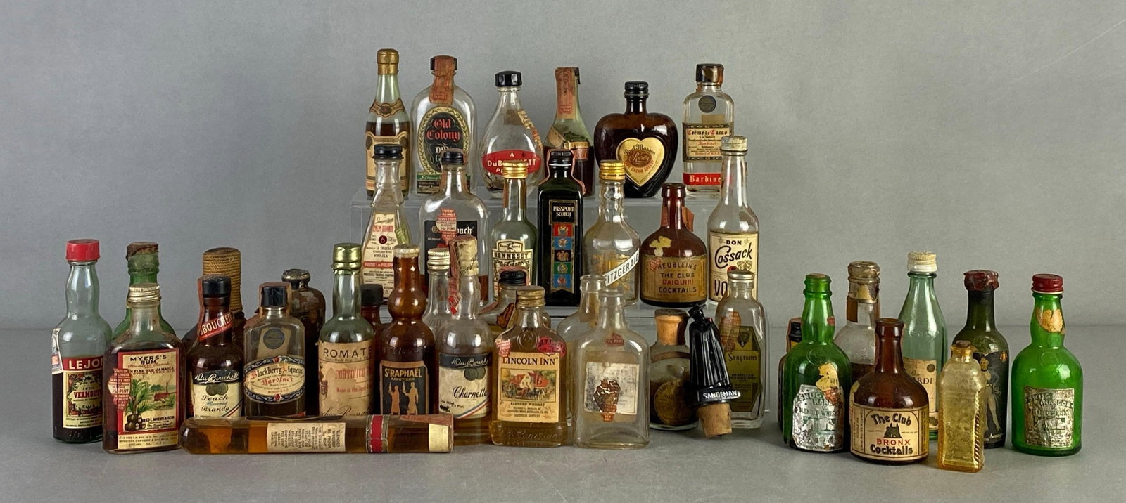 Group of Vintage Miniature Spirits Bottles: Includes Hennessy, Sandman, Seagrams and more, mix of full to empty, largest measures 7 inches tall