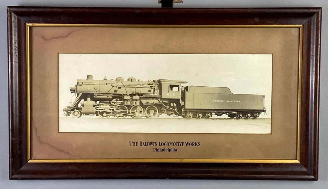 The Baldwin Locomotive Works Philadelphia I.C.R.R. Locomotive Steam Engine and Tender Photograph: Western Maryland Engine No. 810, Frame measures 15 1/4 x 27 1/4 inches, Photograph measures 7 1/2 x 19 inches.