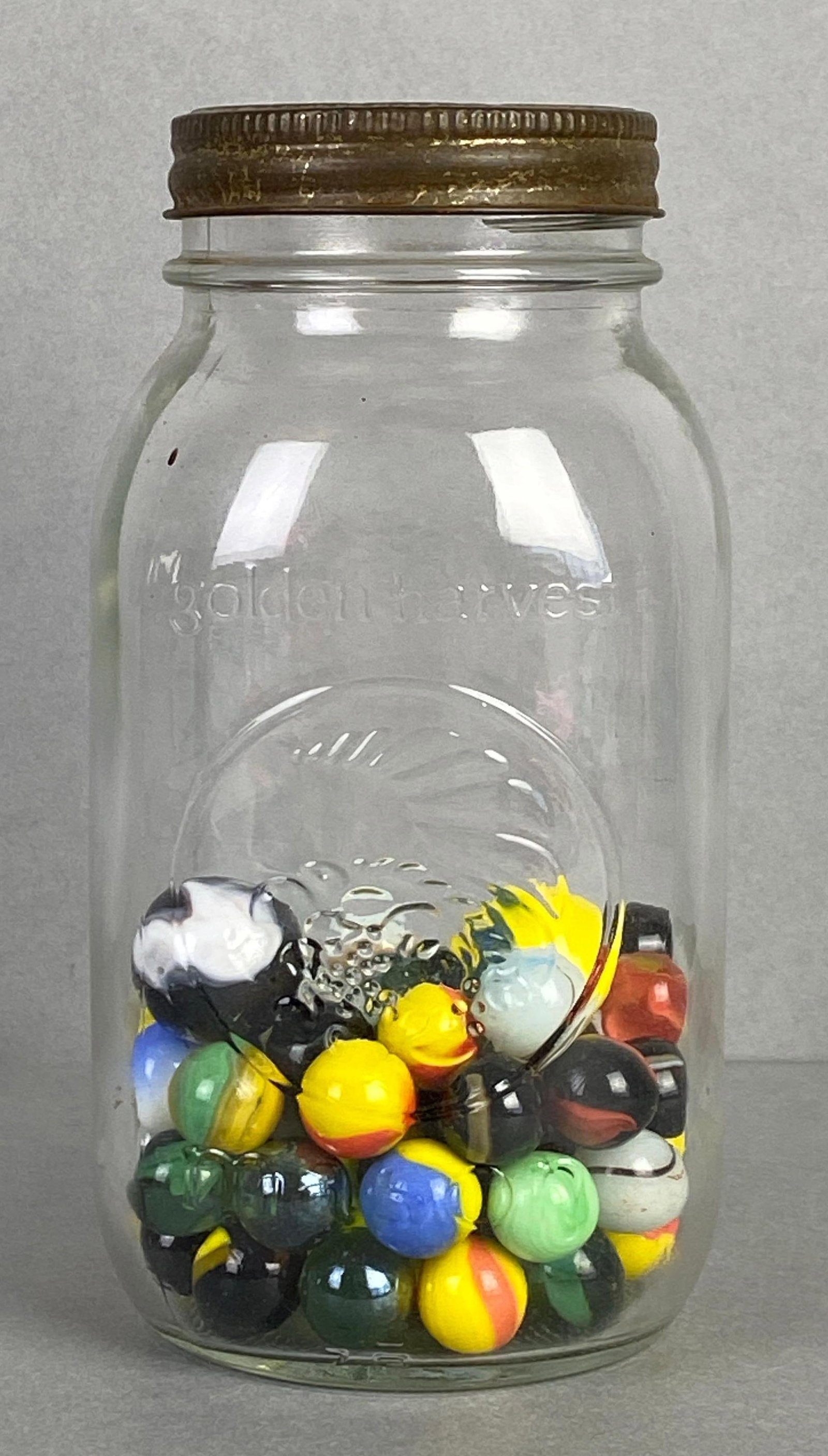 Glass Jar of Billies Quebec Canada Glass Marbles: Glass jar measures 7 x 3 1/2 x 3 1/2 inches