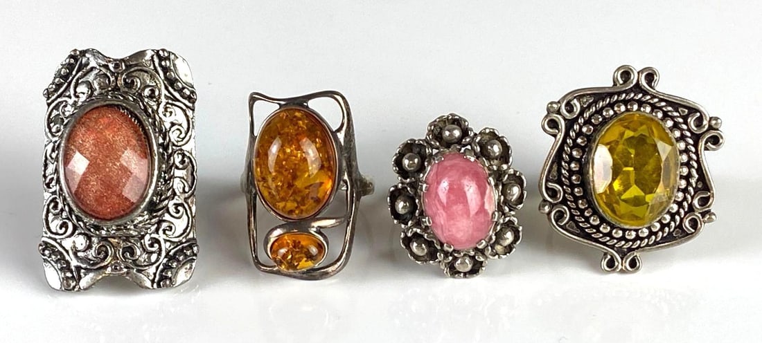 Group of Sterling Silver and Costume Jewelry Rings: Sizes range from 6 3/4 - 9, Includes 2 sterling rings, Includes sandstone, Amber, CZ, and Rhodochrosite.