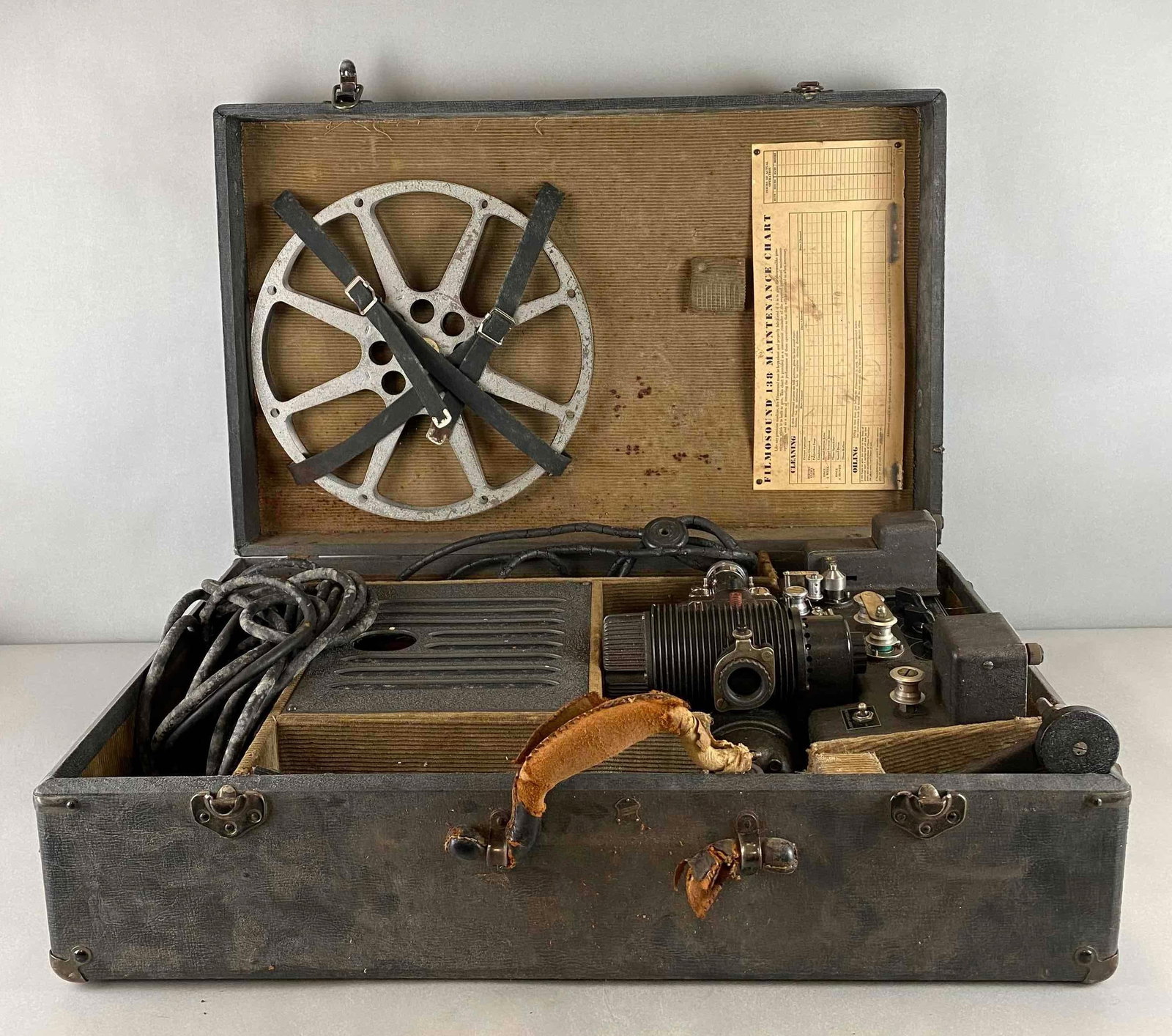 Antique Bell and Howell Filmosound 138 Reproducer: Handle is broken. 16 mm sound on Film reproducer. Case measures 17 3/4 x 27 3/4 x 8 1/2 inches.