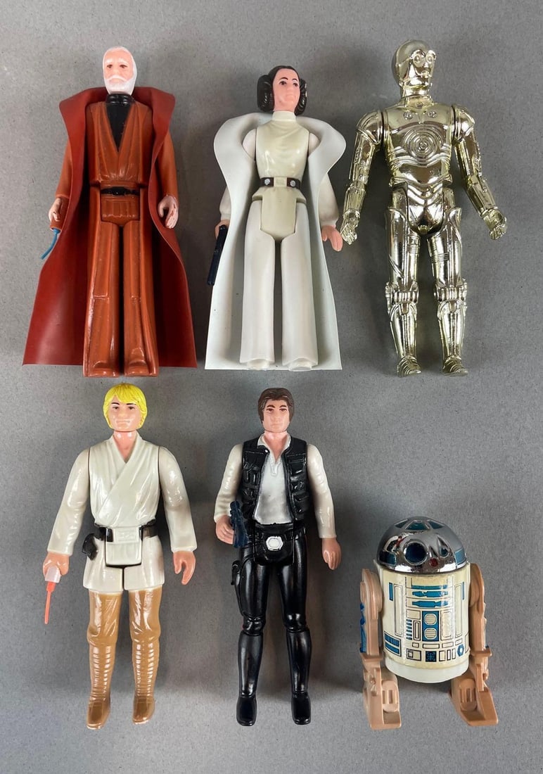 Group of 1977 Kenner Star Wars Action Figures with Accessories: Includes Luke Skywalker with shorter extendable lightsaber, Han Solo and Princess Leia with blasters