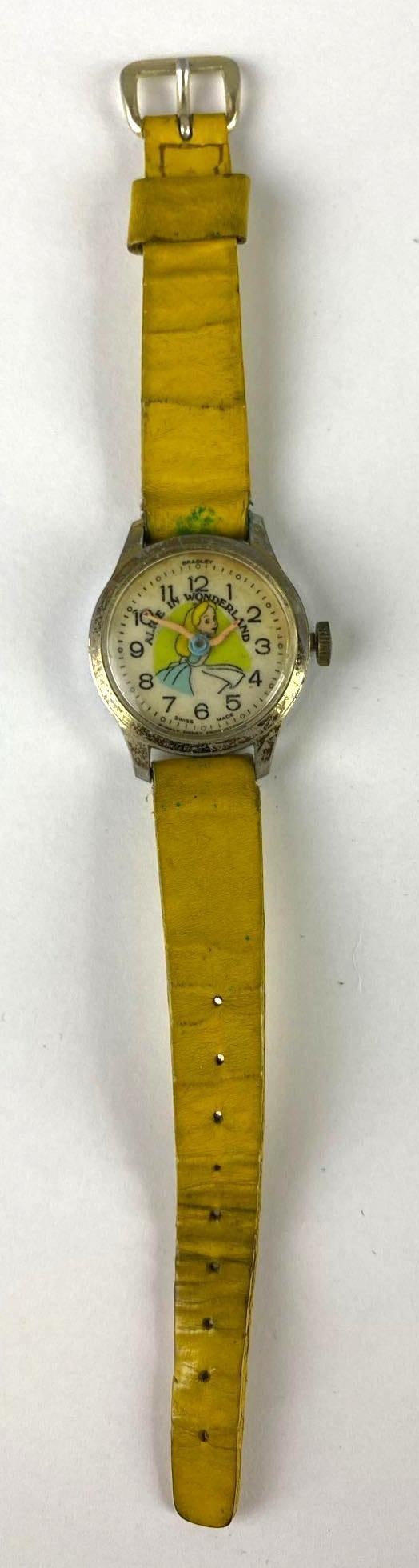 Vintage Swiss Made Disney Alice in Wonderland Wrist Watch: Working condition unknown. Marked Hong Kong. Length measures 6 3/4 inches.