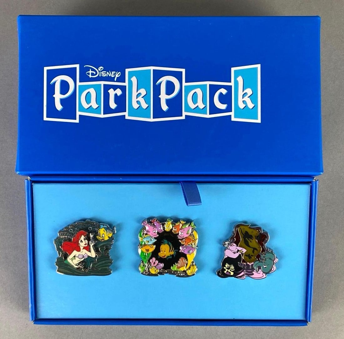 Disney ParkPack The Little Mermaid Enamel 3-Pin Set: Set of 3 Enamel pins, Includes Ariel, Flounder, and Ursula, Box measures 4 3/4 x 8 1/2 x 2 1/2 inches.