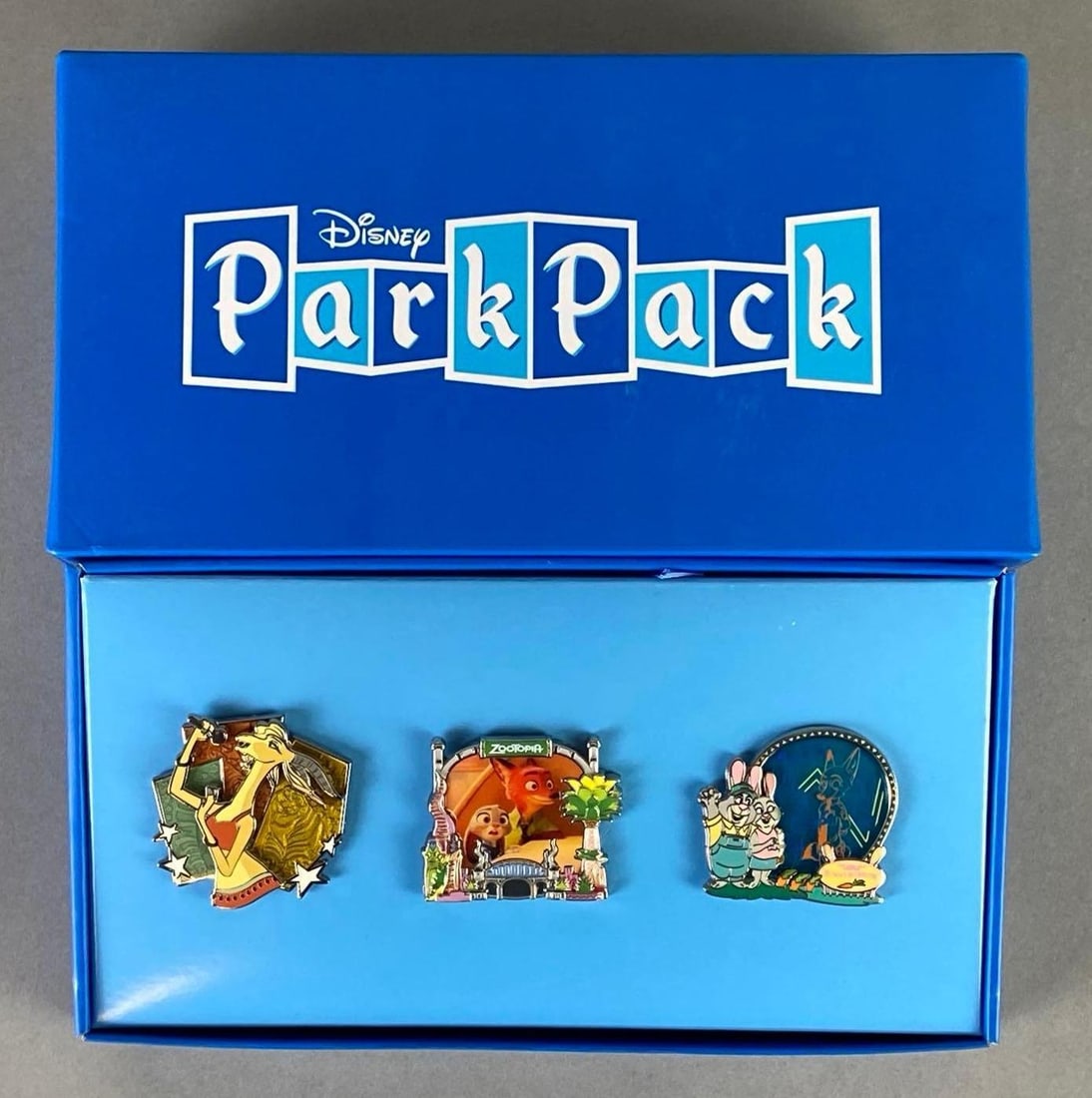 Disney ParkPack Zootopia Enamel 3-Pin Set: Set of 3 enamel pins, Includes Judy, Nick, Giselle, and parents, Box measures 4 3/4 x 8 1/2 x 2 1/2 inches.