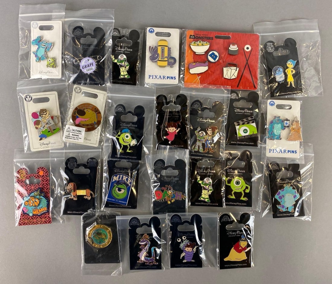Group of 31 Disney Enamel Pins: Includes Carl, Buzz, Mike and more. Largest pin measures 1 3/4 x 1 3/4 inches.