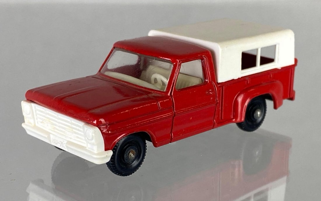 Matchbox No. 6 Ford Pick-Up: A Lesney Product, Red body, White interior, Black base, Black plastic wheels, Die-Cast, Made in England.