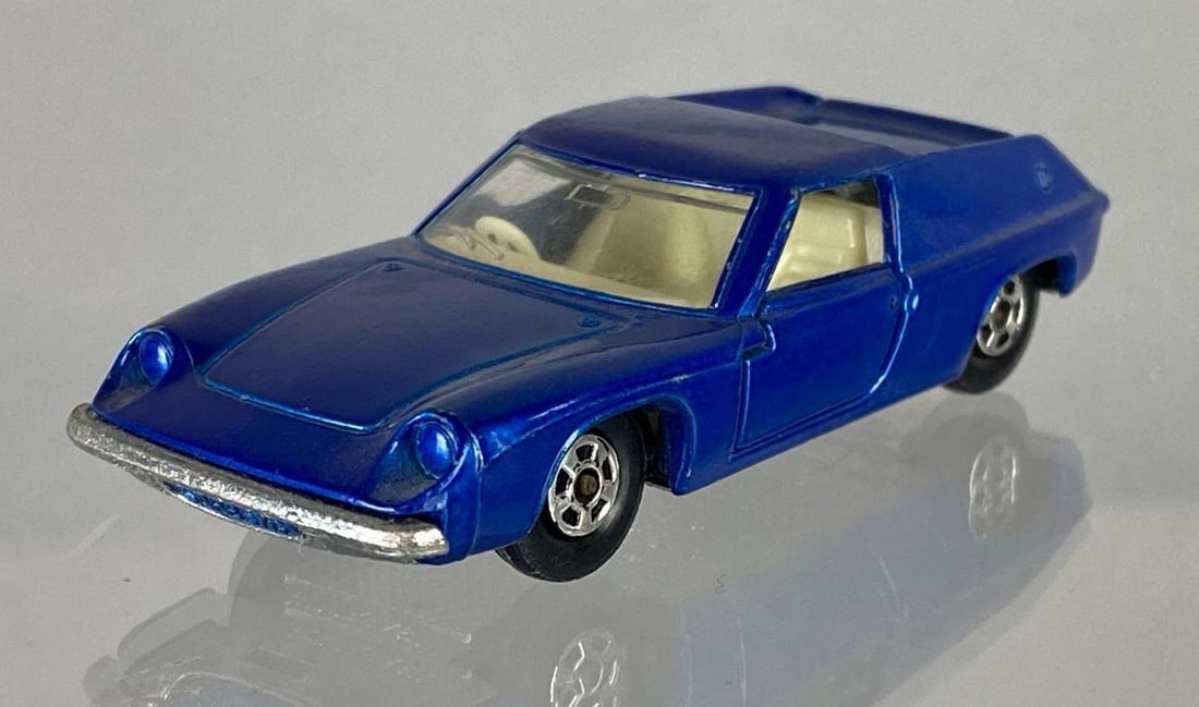 1969 Matchbox No. 5 Lotus Europa: Issue date 1969, A Lesney Product, Die-Cast, Blue body, Cream interior, Silver base, Clear window, Black plastic wheels, Made in England.