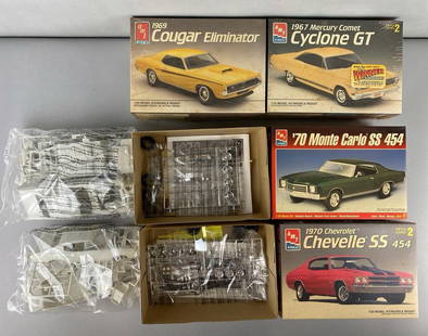 Group of 4 1/25 Scale Model Car Kits: 2 are factory sealed and 2 are open. Complete sets. Includes AMT ERTL 1970 Chevrolet Chevelle SS 454, AMT ERTL 1970 Monte Carlo SS 454, AMT ERTL 1967 Mercury Comet Cyclone GT and more. Largest box mea