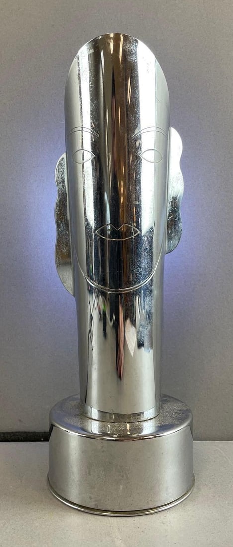 1935 Helen Dryden Art Deco Stylized Table Desk Masque Lamp: Chromed steel, working condition. Measures 10 1/4 x 3 1/2 inches