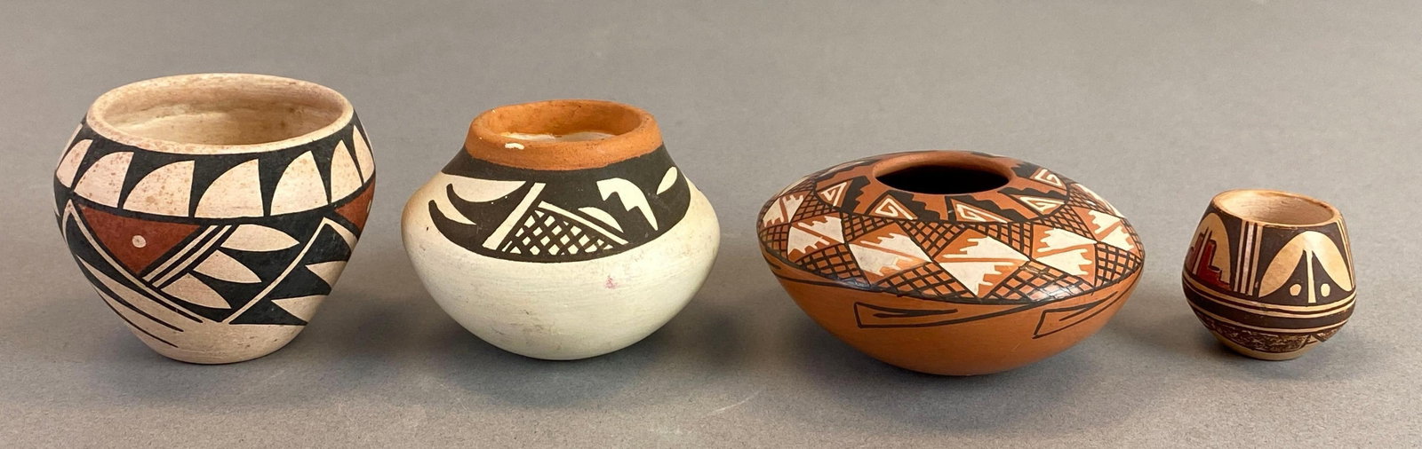 Group of 4 New Mexico Native American Pottery: 3 pieces marked on base, largest measures 2 x 2 1/2 x 2 1/2 inches